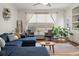 Living room featuring hardwood floors, a comfortable sectional sofa, and window views at 1339 River Otter Court, Mount Pleasant, SC 29466