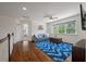 Living room area with bright blue rug, view to the outdoors, and plenty of seating at 1339 River Otter Court, Mount Pleasant, SC 29466