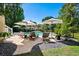 A tranquil backyard oasis featuring a sparkling pool, cozy lounge chairs, and lush landscaping at 1339 River Otter Court, Mount Pleasant, SC 29466
