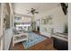 Relaxing screened porch with comfortable seating, ceiling fan, and view to the yard, ideal for enjoying the outdoors at 1339 River Otter Court, Mount Pleasant, SC 29466