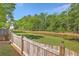 Backyard view with green grass overlooking a small creek at 134 Comiskey Park Cir, Summerville, SC 29485