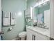 Powder bathroom with light blue walls, updated fixtures and mirror at 134 Comiskey Park Cir, Summerville, SC 29485