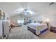 Spacious bedroom with two beds, a ceiling fan, and plenty of natural light at 134 Comiskey Park Cir, Summerville, SC 29485