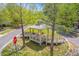 A charming gazebo sits on a brick-paved corner, surrounded by young trees and well-kept landscaping at 134 Comiskey Park Cir, Summerville, SC 29485