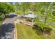 Aerial view of a gazebo offering a shaded seating area with grassy surroundings and fresh, spring foliage at 134 Comiskey Park Cir, Summerville, SC 29485