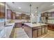Kitchen with dark wood cabinets, a center island with white countertop, and stainless steel appliances at 134 Comiskey Park Cir, Summerville, SC 29485