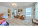 Bright living room featuring wood floors, neutral walls, ample natural light and modern furniture at 134 Comiskey Park Cir, Summerville, SC 29485