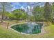 Scenic community pond with a fountain feature surrounded by lush landscaping at 134 Comiskey Park Cir, Summerville, SC 29485