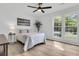 Bedroom with large bright windows, ceiling fan, and neutral decor at 1387 W Lenevar Dr, Charleston, SC 29407