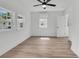 Well-lit bedroom featuring hardwood floors and a ceiling fan at 1387 W Lenevar Dr, Charleston, SC 29407