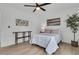 Bedroom with ceiling fan, light-colored walls, and natural lighting at 1387 W Lenevar Dr, Charleston, SC 29407