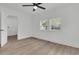 Bright bedroom with hardwood floors, ceiling fan, and ample natural light at 1387 W Lenevar Dr, Charleston, SC 29407