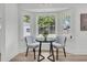 Breakfast nook with natural light from bay window and seating for two at 1387 W Lenevar Dr, Charleston, SC 29407