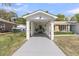 The carport, featuring classic brick pillars and a welcoming walkway at 1387 W Lenevar Dr, Charleston, SC 29407