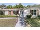 Close-up of the home's entry with a blue door and decorative shutters at 1387 W Lenevar Dr, Charleston, SC 29407