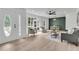Bright, open-concept living room with large windows and stylish decor at 1387 W Lenevar Dr, Charleston, SC 29407