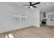 Bright living room featuring a ceiling fan and hardwood floors at 1387 W Lenevar Dr, Charleston, SC 29407