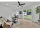 Bright and open living room with backyard view and light-colored wood floors at 1387 W Lenevar Dr, Charleston, SC 29407