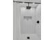 Walk in shower with white tiling and sleek fixtures in the bathroom at 1387 W Lenevar Dr, Charleston, SC 29407