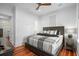Comfortable bedroom with hardwood floors, ceiling fan and stylish furnishings at 139 Tradd St # 2, Charleston, SC 29401