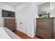 Bedroom showcasing built-in cabinets, two dressers, and gleaming hardwood floors at 139 Tradd St # 2, Charleston, SC 29401