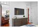 Bedroom features a TV, dresser, and doorway to the living room at 139 Tradd St # 2, Charleston, SC 29401