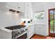 Well-appointed kitchen boasts stainless steel appliances, gas cooktop and subway tile backsplash at 139 Tradd St # 2, Charleston, SC 29401