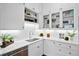 Modern kitchen with white cabinets, marble countertops, and stainless steel appliances at 139 Tradd St # 2, Charleston, SC 29401