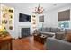 Comfortable living room with fireplace, built-in shelving, and a large sectional sofa at 139 Tradd St # 2, Charleston, SC 29401