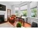 Comfortable living room features hardwood floors, bay windows, a fireplace, and stylish decor at 139 Tradd St # 2, Charleston, SC 29401