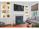 Inviting living room features a fireplace, built-in shelving, and gleaming wood floors at 139 Tradd St # 2, Charleston, SC 29401