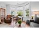 Living room showcasing hardwood floors, bay windows, neutral walls, and comfortable seating at 139 Tradd St # 2, Charleston, SC 29401