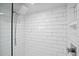 Close up of the white tiled shower with rain style shower head at 139 Tradd St # 2, Charleston, SC 29401