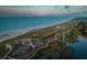 Stunning aerial view of a coastal golf course, pristine beach, and winding waterways at 14 Royal Beach Dr, Kiawah Island, SC 29455
