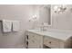 Elegant bathroom features a marble countertop, white cabinetry, and stylish lighting fixtures at 14 Royal Beach Dr, Kiawah Island, SC 29455