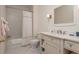 Well-lit bathroom with classic fixtures, tile flooring, and shower-tub combo with curtain at 14 Royal Beach Dr, Kiawah Island, SC 29455