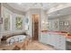 A luxurious bathroom features a soaking tub, a marble countertop vanity, and walk-in shower at 14 Royal Beach Dr, Kiawah Island, SC 29455