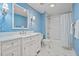 Charming bathroom showcases blue wallpaper, marble countertops, and a stylish shower-tub combination at 14 Royal Beach Dr, Kiawah Island, SC 29455