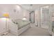 A bright bedroom with a trundle bed and ensuite bathroom at 14 Royal Beach Dr, Kiawah Island, SC 29455