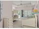 Inviting bedroom features a bunk bed, a built-in window seat, and soft, neutral colors at 14 Royal Beach Dr, Kiawah Island, SC 29455