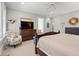 Main bedroom showcases stylish furniture, a ceiling fan, and shuttered windows for ample lighting at 14 Royal Beach Dr, Kiawah Island, SC 29455
