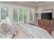 Inviting bedroom featuring bright natural light with large window shutters at 14 Royal Beach Dr, Kiawah Island, SC 29455