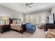 A beautiful main bedroom suite with a ceiling fan and plenty of natural light from shuttered windows at 14 Royal Beach Dr, Kiawah Island, SC 29455