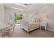 A charming bedroom with a cozy bed and French doors leading to a balcony at 14 Royal Beach Dr, Kiawah Island, SC 29455
