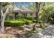 Charming home with manicured landscaping, mature trees, and inviting entrance at 14 Royal Beach Dr, Kiawah Island, SC 29455
