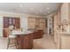 Spacious kitchen featuring a center island, breakfast bar, and custom cabinets at 14 Royal Beach Dr, Kiawah Island, SC 29455