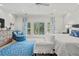 Bright, airy main bedroom featuring a comfortable seating area and bright natural light at 14 Royal Beach Dr, Kiawah Island, SC 29455