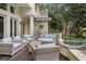Beautiful outdoor patio with lounge seating, grill, and hot tub at 14 Royal Beach Dr, Kiawah Island, SC 29455
