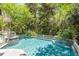 Sparkling pool featuring a waterfall feature and lush landscaping at 14 Royal Beach Dr, Kiawah Island, SC 29455