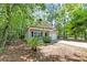 Charming home with a front porch, manicured lawn, and lush greenery, offering great curb appeal at 1453 Joy Ave, Charleston, SC 29407